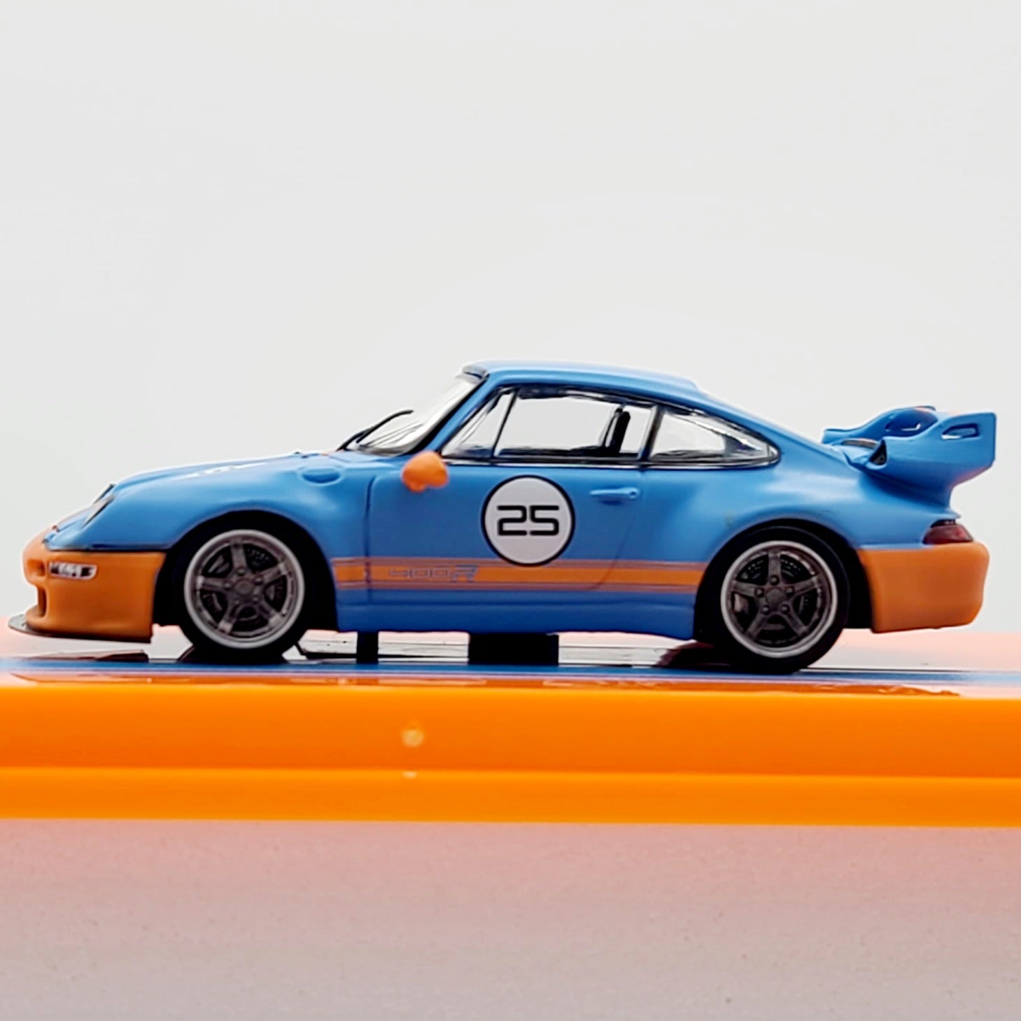 Tarmac Works Porsche 993 Remastered by Gunther Werks - 1:64 scale, blue/orange (2024 Hobby64)